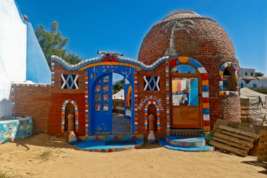 a colorful building with a blue roof